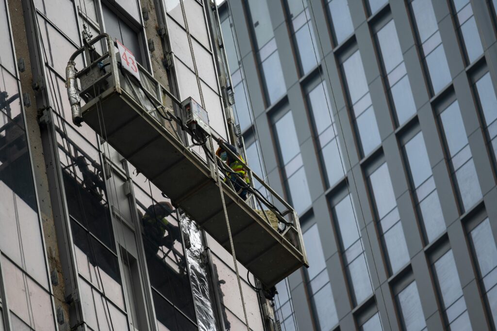 Professional scaffolding crew working on construction site